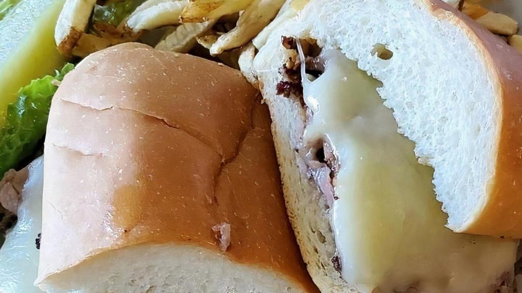 French Dip* · Thinly Sliced Sirloin, topped with melted Jack Cheese on grilled French Roll. Served with Au Jus