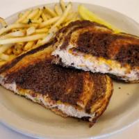 Tuna Melt* · Our Homemade Tuna Salad with melted Cheddar Cheese on grilled Rye Bread