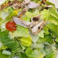 Cobb Salad* · Turkey, ham, bacon, blue cheese crumble, cheddar cheese, avocado, tomato, chopped romaine to...