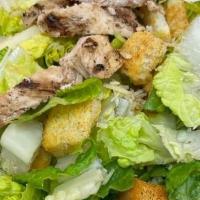 Chicken Caesar Salad* · Crisp chilled romaine lettuce, croutons, grated Parmesan cheese and tossed with our creamy C...