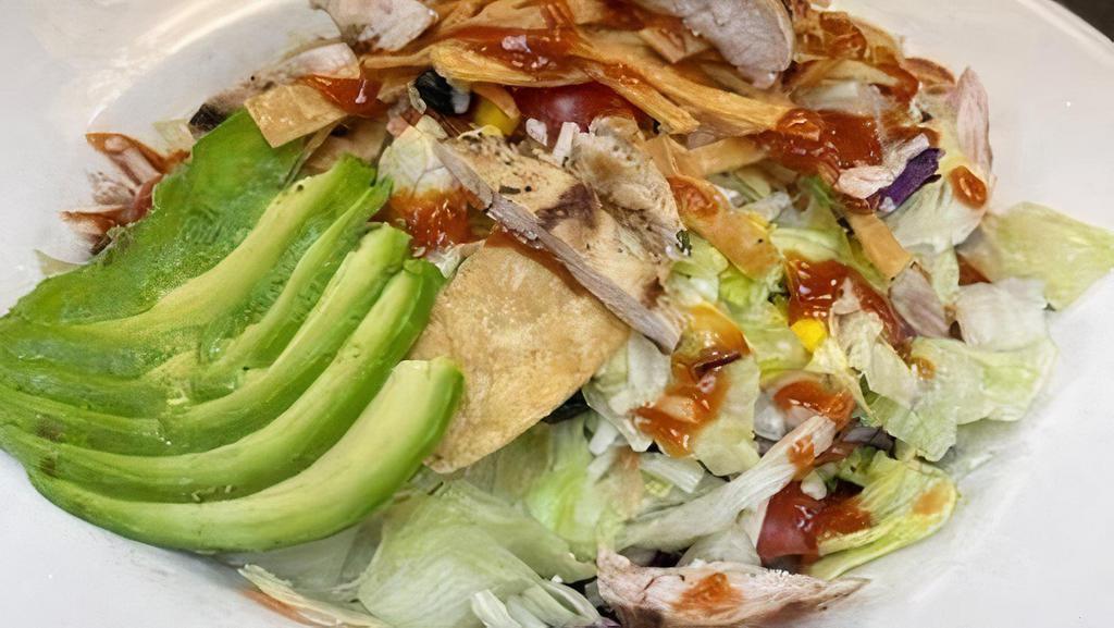 BBQ Chicken Salad* · Chopped lettuce, black beans, sweet corn, Cilantro, basil, tortilla chips and Monterey jack cheese shredded. Tossed with ranch, topped with bbq chicken breast and cherry tomatoes.