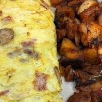 Meat Lovers Omelette* · Filled with ham, bacon and sausage, Jack, American and cheddar cheese.
