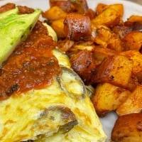 Mexicano Omelette* · Filled with jalapeno chilies, avocado, sour cream, Jack cheese, topped with fresh salsa. Ser...