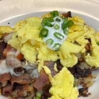 Hash Brown Skillet* · Our fresh hasbrowns topped with jack cheese, fresh tomatoes, bacon, sour cream, green onions...