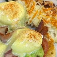 California Benedict* · Two strips of bacon, avocado, tomatoes and poached eggs on an English muffin with hollandais...