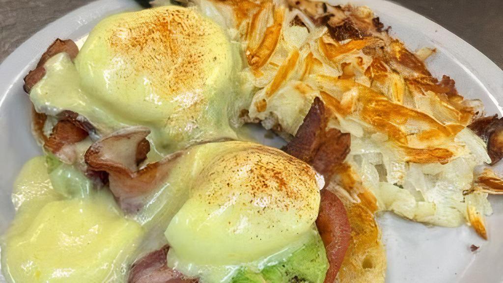 California Benedict* · Two strips of bacon, avocado, tomatoes and poached eggs on an English muffin with hollandaise sauce.