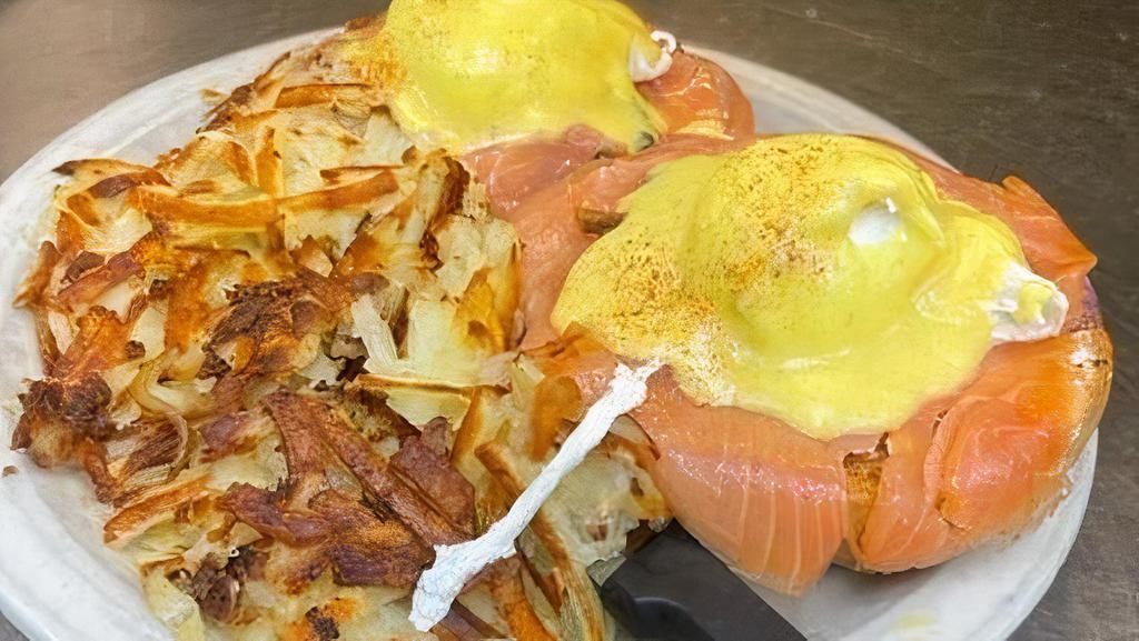 Smoked Salmon Benedict* · Toasted bagel with cream cheese, grilled red onions, Norwegian smoked salmon, capers, poached eggs and hollandaise sauce.