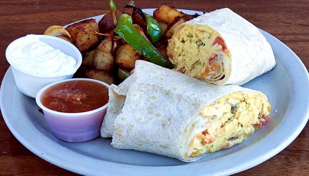 Breakfast Burrito · Four eggs stuffed with linguica, ortega green chilies, tomatoes and cheddar cheese, stuffed and rolled in a large flour tortilla, served with sour cream and fresh salsa.