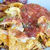 Chilaquiles · Eggs scrambled with corn tortillas, chorizo, onions, jalapenos and jack cheese. Topped with ...