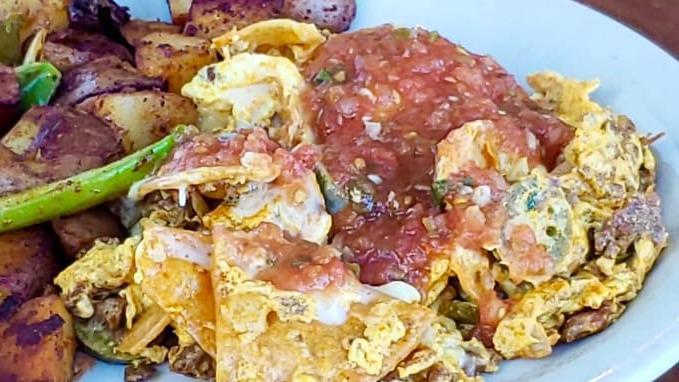 Chilaquiles · Eggs scrambled with corn tortillas, chorizo, onions, jalapenos and jack cheese. Topped with freshly made salsa.
