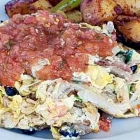 Jalisco Scramble · Eggs scrambled with tomatoes, onions, cilantro, black beans and pork carnitas, topped with f...