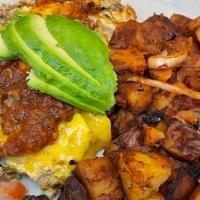 Chorizo Scramble · Chorizo, avocado, tomatoes and onions topped with cheddar cheese. Served with fresh salsa.