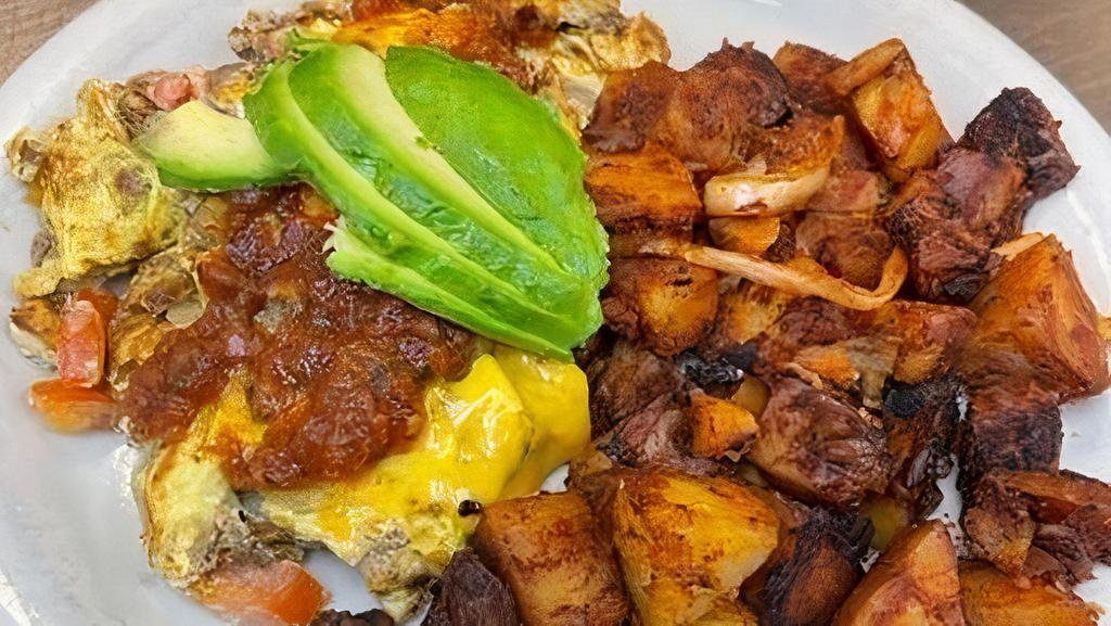 Chorizo Scramble · Chorizo, avocado, tomatoes and onions topped with cheddar cheese. Served with fresh salsa.