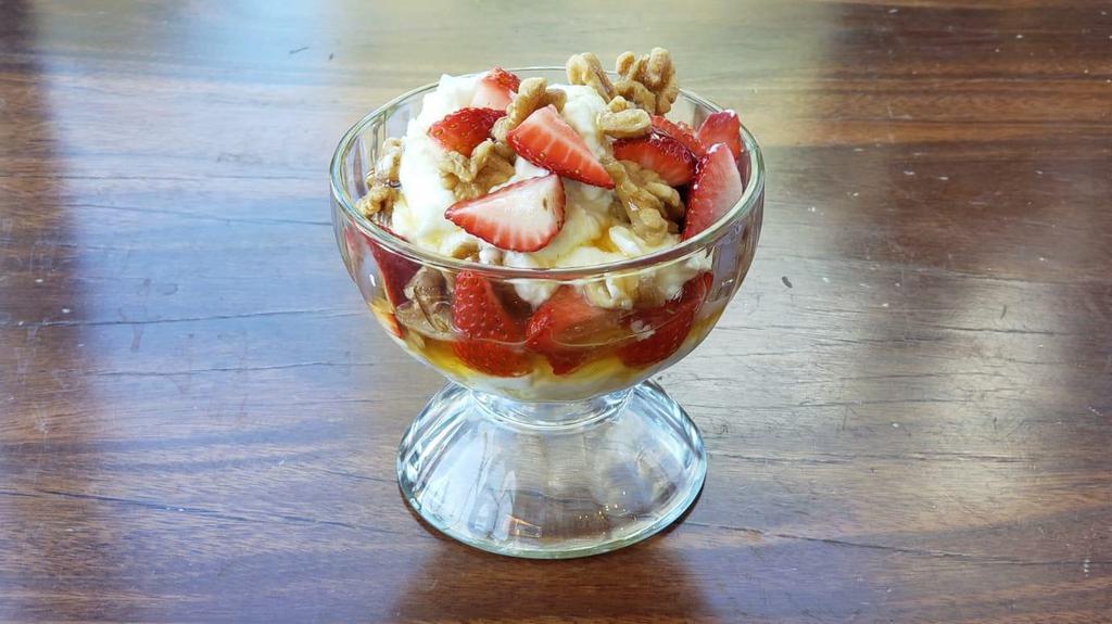 Yogurt 'N Honey · Imported tart Greek yogurt topped with strawberries, and honey. A must try!