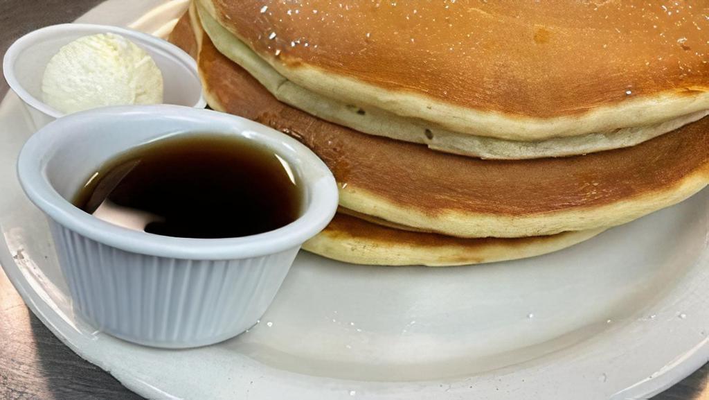 Pancake Combo* · Bacon or sausage and two eggs any style. Served with two buttermilk pancakes.