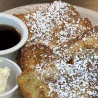 French Toast Combo · Two thick slices of french toast, served with two eggs and your choice of ham, bacon or saus...