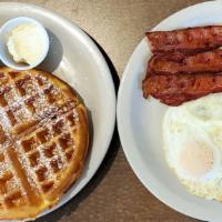 Belgian Traditional · Crisp Belgian waffle with two eggs any style and your choice of ham, bacon or sausage.