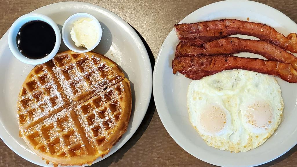 Belgian Traditional · Crisp Belgian waffle with two eggs any style and your choice of ham, bacon or sausage.