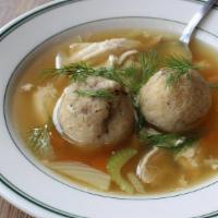 Frozen Matzoh Ball Soup with Nuts - Quart, serves 2 · Chicken brodo, Stoll family matzoh balls (walnut in the middle), veggies, dill