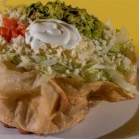 Taco Salad · Deep-fried flour tortilla with rice, beans lettuce, sour cream, and freshly made guacamole.