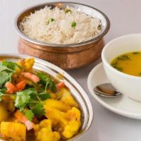 Aloo Cauli · Cauliflower and potatoes, cooked in aromatic spices optional vegan served with 8oz of rice a...