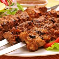 Chicken Kabab · Hot & Tasty Chicken kabab cooked to perfection. Served on a bed of rice with a side of salad.