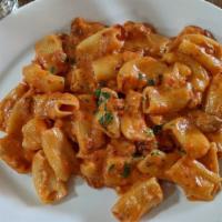 Rigatoni alla Vodka · Homemade pasta tubes, tossed with shallots, applewood smoked bacon, parsley, and a vodka, to...