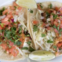 Grilled Fish Tacos · Pacific snapper w/ salsa fresca, habanero mayo, cabbage, and lime