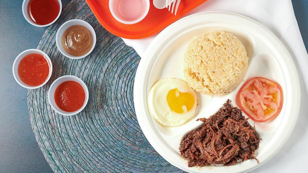 Tapsilog · Favorites. beef tapa braised in our house marinade then shredded.

*includes a side of garlic rice & egg