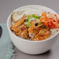 Chicken Teriyaki Bowl · A bowl filled with chicken teriyaki over steamed rice, with kimchi, scallions, and fried egg.