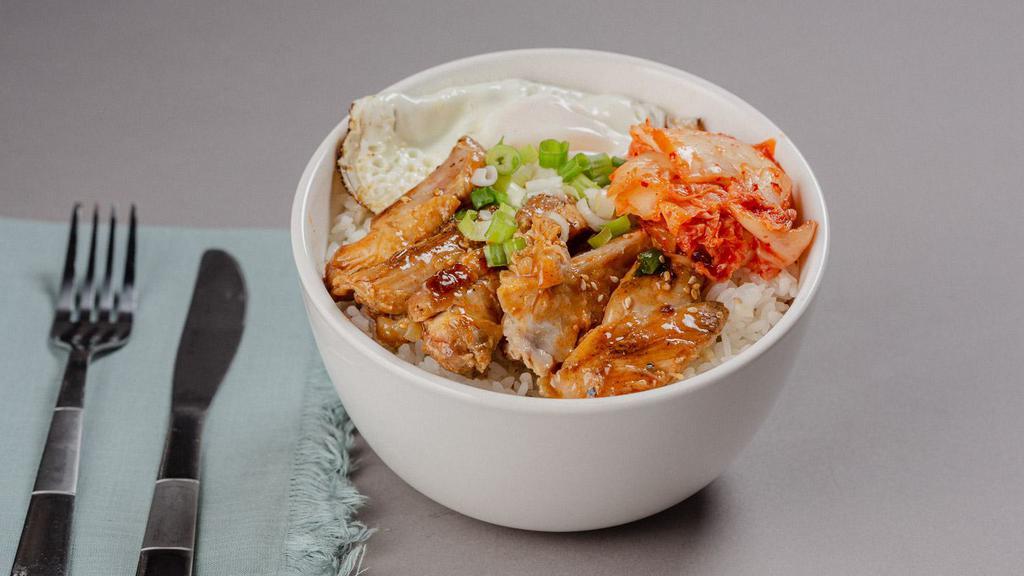Chicken Teriyaki Bowl · A bowl filled with chicken teriyaki over steamed rice, with kimchi, scallions, and fried egg.