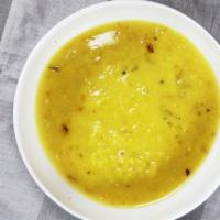 Dal Soup · Home made soup of yellow lentil, fresh tomato, lemon juice and green coriander.