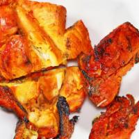 Tandoori Chicken · Chicken marinated with yogurt, garlic, ginger, vinegar and fresh herbs, then cooked in tando...