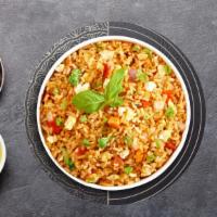 Freddy Fried Rice · Stir fried rice with egg, tomato, onion, scallion, carrot and Chinese broccoli.