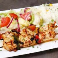 Shish Kebabs · Served with pita, house salad and rice.