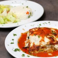 Moussaka · Layers of potato, zucchini and eggplant slow-cooked with bechamel and tomato sauce. Served w...