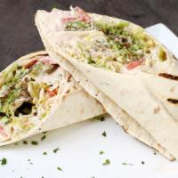 Wraps · All wraps are served on lavash bread with lettuce, tomato, onion, hummus, and tahini sauce.