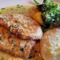 Pork Chop Milanese · Breaded and sautÃ©ed pork cut from rack, topped with a white wine lemon, garlic, and herb sa...