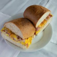 Breakfast Sandwich · Scrambled eggs (2 eggs), Cheese; choice of Ham, Chorizo, Bacon, and Sausage or extra meat.
