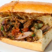 Pan con Lomito · Stir fried steak with onion, tomato, cilantro, and jack cheese on toasted French roll.