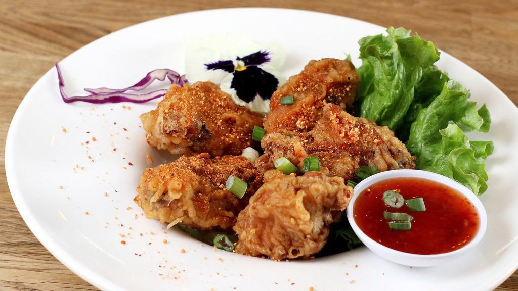 Spicy Crispy Wings · Spicy. Deep fried chicken wings with spicy lime dressing sauce and roasted rice power.