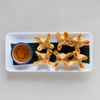 Crack A Crab · Crab meat, carrot, onion, chestnut and cream cheese wrapped in wonton skin. Served with swee...