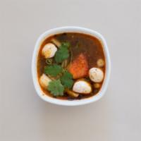 Tom Yum · Hot and sour soup with chicken, lemongrass, tomato, kaffir lime leaves, chilli lime juice, o...