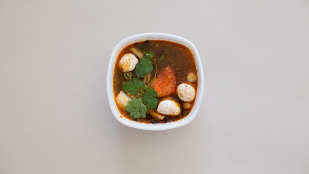 Tom Yum · Hot and sour soup with chicken, lemongrass, tomato, kaffir lime leaves, chilli lime juice, onion and mushroom.