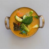 Red Curry · Choice of meat, bamboo shoot, basil, fresh chilli, bell pepper red curry paste, coconut milk.