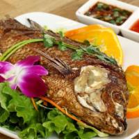 Fried Whole Fish · Deep fried tilapia. Served with spicy house sauce.