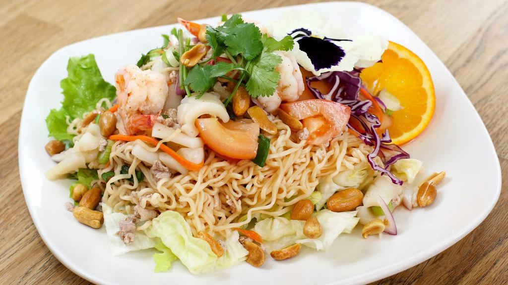 Instant Noodle Spicy Salad · Shrimp, calamari and minced pork with cabbage, garlic, cilantro, onion and chilli lime dressing.