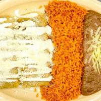 Tamale · Your choice of pork, chicken or jalapeño and cheese topped with sour cream and Cotija cheese.