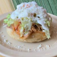 Sope · Handmade thick corn tortilla with your choice of meat topped with lettuce, pico de gallo, so...