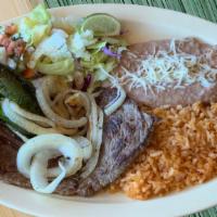Carne Asada Plate · Grilled Carne Asada topped with grilled onions and jalapeños. Served with rice, refried bean...